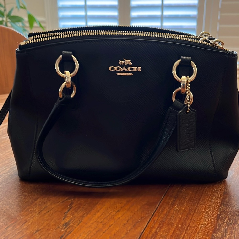 Coach Purse Black Crossbody with top handles and long crossbody strap.